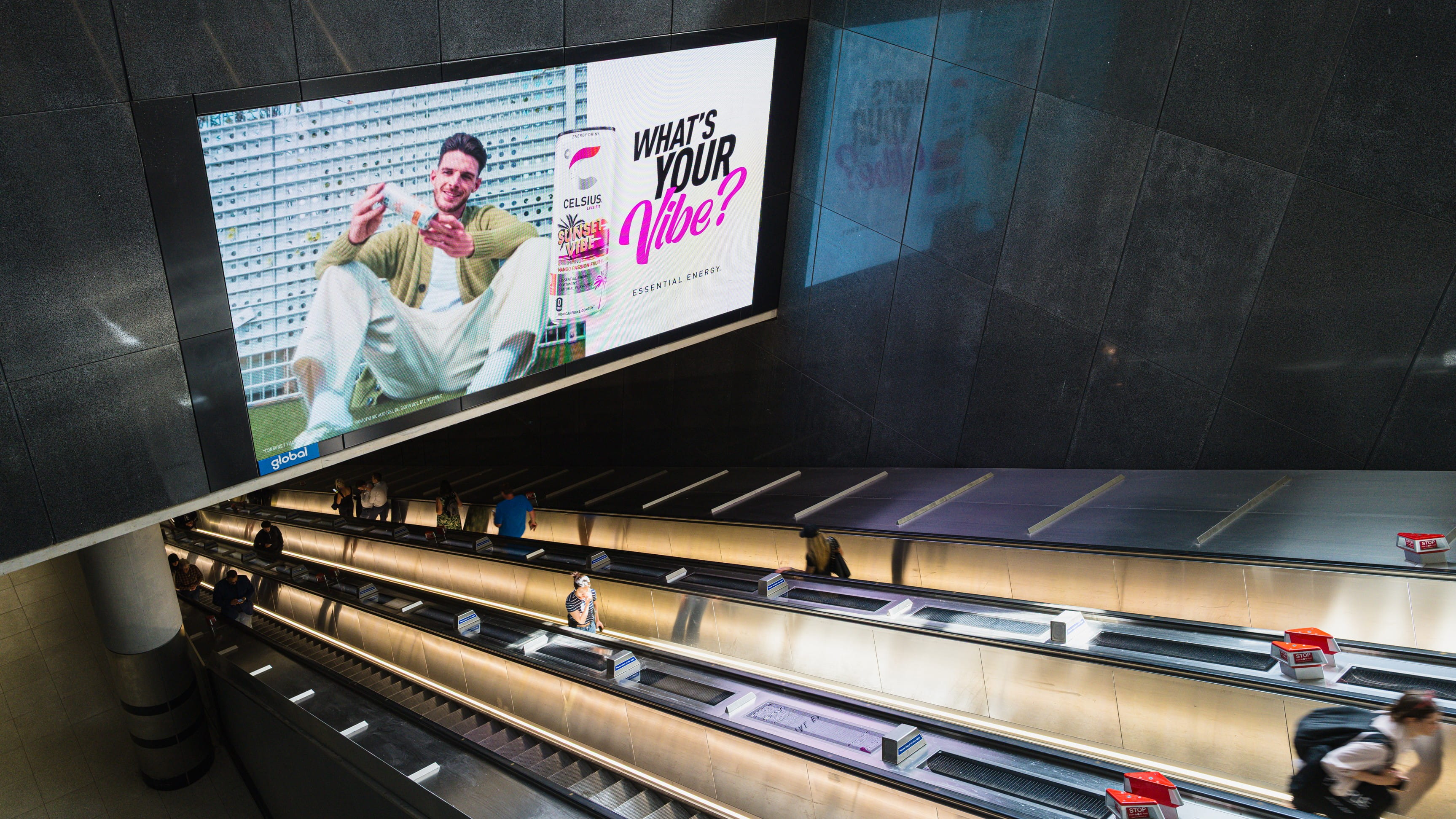Celsius OOH screen above an Underground escalator